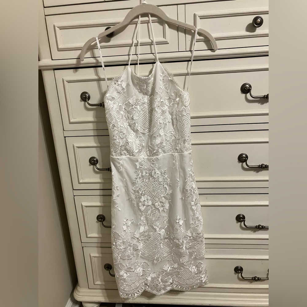 White lace criss cross back LuLu’s dress perfect for wedding, business or dinner